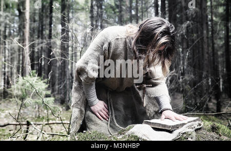 Fairy magician. A sorcerer with a glass sphere, a magical spell  Stock Photo