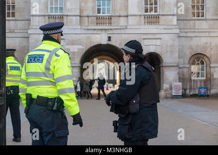 An armed police woman in London Stock Photo