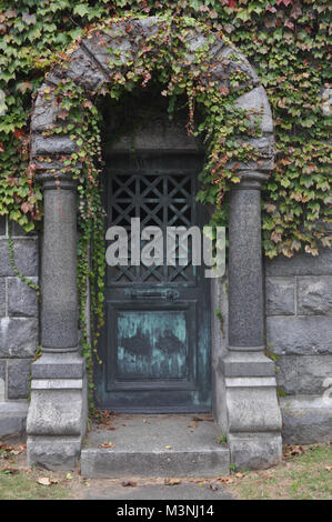 Abandoned Mausoleum Doors in a Cemetery Stock Photo