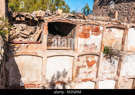 old cemetery wall tombs, open grave, Aguilar de Segarra, Catalonia,  Spain Stock Photo