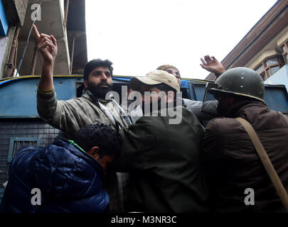 Srinagar, India. 11th Feb, 2018. Police arrest the Members of the Jammu and Kashmir Liberation front (JKLF) after they protested on the aniversary of the hanging of Maqbool Bhat in indian jail in 1984 during a curfew in Srinagar, Kashmir on 11th February. Curfew was imposed in dirrferent parts of valley to thrawt the protests against the aniversary of the execution of JKLF member. Credit: Muzamil Mattoo/Pacific Press/Alamy Live News