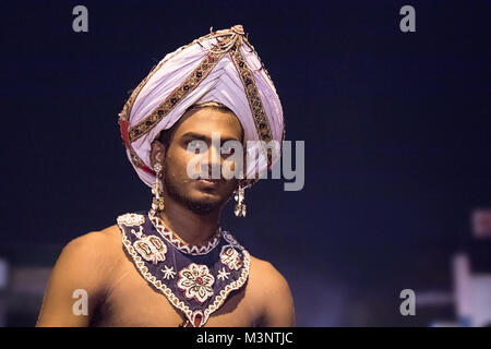 Sri Lanka Kandy Esala Perahera parade performer dancer wearing turban traditional costume Stock Photo