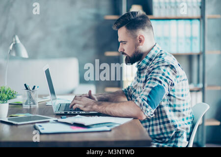 Profile side view photo of confident concentrated responsible diligent intelligent smart clever freelancer using netbook for developing new project Stock Photo