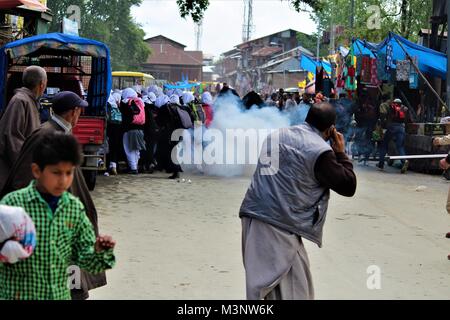 tear gas shell explodes near Kashmiri students protesting, Kashmir, India, Asia Stock Photo