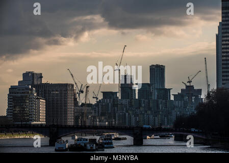 London skyline with construction cranes. River Thames. Lambeth Bridge. Nine Elms Point. St George Wharf. Tower cranes. Heavy clouds Stock Photo