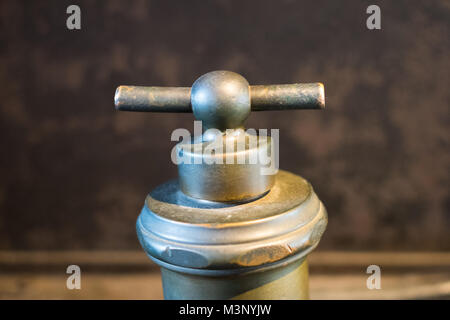 old turning knob /tap, metal faucet, vintage handle - Stock Photo