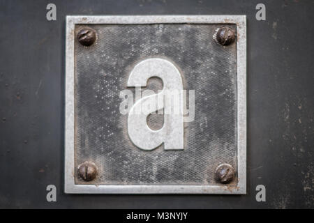 letter A on metal sign on metal background - small a Stock Photo