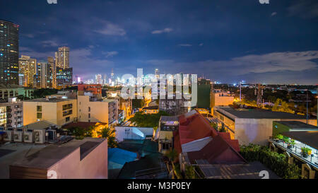 Time lapse view of Makati skyscrapers in Manila city. Skyline at night, Philippines.