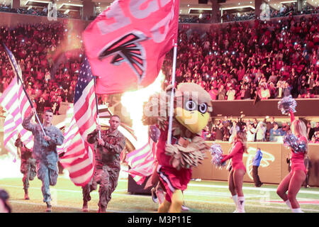 New Orleans Saints vs. Atlanta Falcons. Fans support on NFL Game.  Silhouette of supporters, big screen with two rivals in background Stock  Photo - Alamy