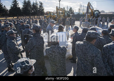 374th Civil Engineer Squadron conducts a rapid airfield damage repair demonstration aboard Yokota Air Base by #PACOM Stock Photo