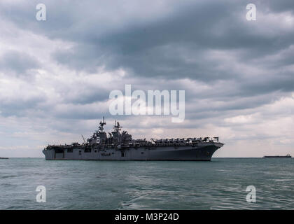 171222-N-FV739-027  CHANGI, Singapore (Dec. 22, 2017) - The amphibious assault ship USS America (LHA 6) pulls in to RSS Singapura - Changi Naval Base, Singapore during a regularly scheduled port visit Dec. 22. America, part of the America Amphibious Ready Group, with embarked 15th Marine Expeditionary Unit, is operating in the Indo-Asia Pacific region to strengthen partnerships and serve as a ready-response force for any type of contingency. (U.S. Navy photo by Mass Communication Specialist 3rd Class Christopher A. Veloicaza) USS America arrives in Singapore by #PACOM Stock Photo