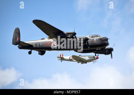 Avro Lancaster ans Supermarine Spitfire in close formation over Lincolnshire, UK. Stock Photo