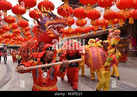 Kaili, China's Guizhou Province. 11th Feb, 2018. People perform lion dance to greet the upcoming Spring Festival in Xiasi ancient town of Kaili City, southwest China's Guizhou Province, Feb. 11, 2018. The Spring Festival, or the Chinese Lunar New Year, falls on Feb. 16 this year. Credit: Kai Shangyu/Xinhua/Alamy Live News Stock Photo