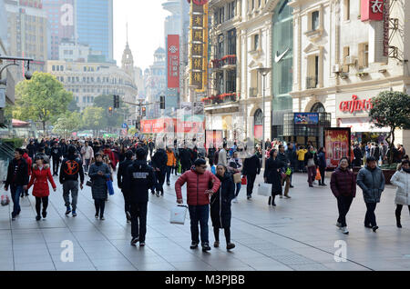 Shanghai, China. 12th February 2018. Most important holiday in China: Chinese New Year, Year of Dog. Chinese families enjoying shopping in Nanjing Road on 12th February. Credit: Bartlomiej Magierowski/Alamy Live News Stock Photo