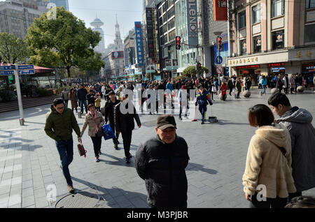 Shanghai, China. 12th February 2018. Most important holiday in China: Chinese New Year, Year of Dog. Chinese families enjoying shopping in Nanjing Road on 12th February. Credit: Bartlomiej Magierowski/Alamy Live News Stock Photo