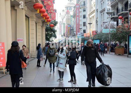 Shanghai, China. 12th February 2018. Most important holiday in China: Chinese New Year, Year of Dog. Chinese families enjoying shopping in Nanjing Road on 12th February. Credit: Bartlomiej Magierowski/Alamy Live News Stock Photo