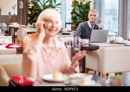 Interested mature man admiring woman Stock Photo