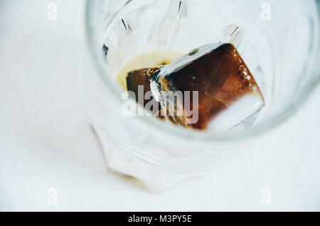 Ice cubes made with coffee in blue ice cube tray to prepare refreshing  coffee drinks like iced coffee. White background, view from above, isolated  Stock Photo - Alamy