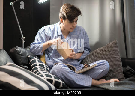 Young Man Chilling at Home Stock Photo