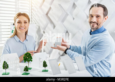 Delighted colleagues working on an eco-friendly project Stock Photo