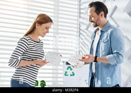 Cheerful landscape designers looking at their creations Stock Photo