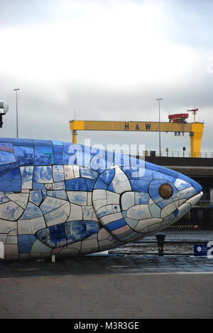 The Big Fish statue and h&w crane in the background, Belfast, Northern Ireland, UK Stock Photo