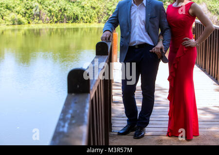 Beautiful mature couple standing near lake Stock Photo