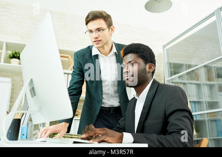 Two Young Businessmen Planning Startup Stock Photo