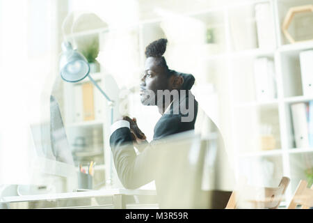 Young  African Businessman using PC Stock Photo