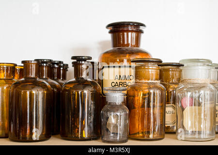 Many small glass medical bottles. Stock Photo