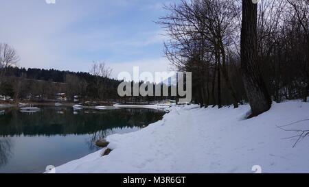 Terfens Tyrol Austria near Schwaz and Innsbruck - swimming and fishing lake Weisslahn in Winter Stock Photo
