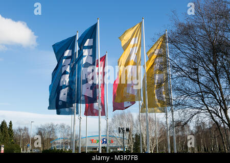 Yellow, blue & red IKEA flags outside store. Warrington, UK. Taken 12th February 2018 after IKEA founder Ingvar Kamprad died aged 91. Stock Photo