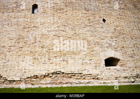 Brick wall with two small windows Stock Photo