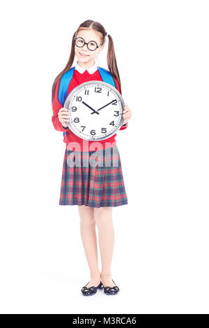 Smiling Asian School Girl Holding Book With Backpack Isolated On Yellow 