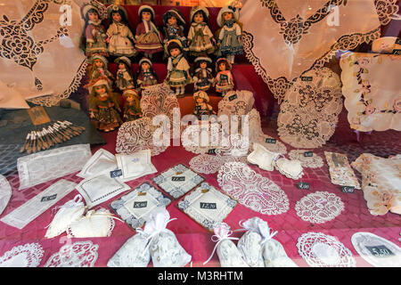 BRUGES, BELGIUM - JUNE 10, 2014: Famous handmade lace for sale in Bruges Stock Photo