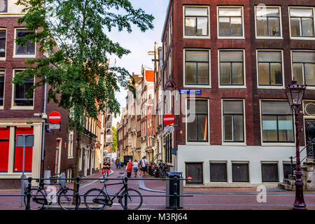 AMSTERDAM, THE NETHERLANDS - JUNE 10, 2014: Beautiful facades of canal buildings in Amsterdam