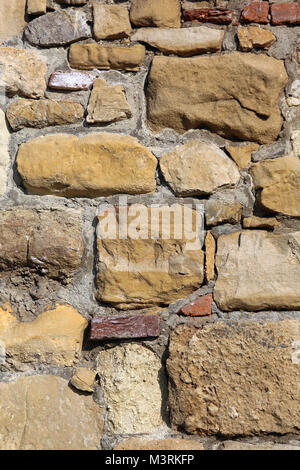 Medieval Castle Wall Made From Various Stones and Bricks Stock Photo