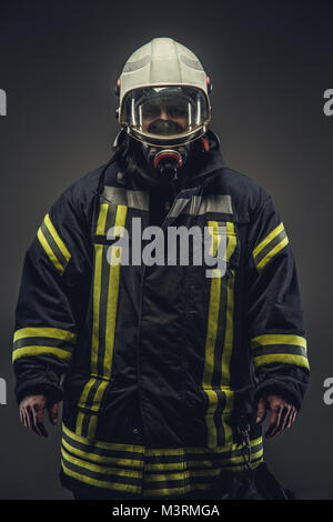 Portrait of firefighter in oxygen mask. Stock Photo