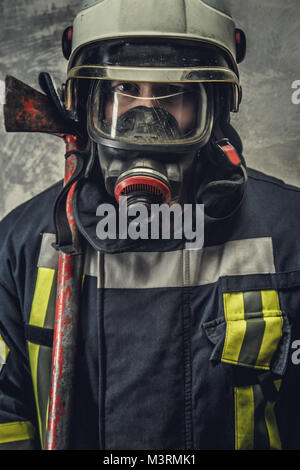 Portrait of firefighter in oxygen mask. Stock Photo