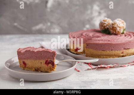Pink berry caramel raw vegan cheesecake. Healthy vegan food concept. Stock Photo