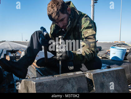 151117-N-UM507-008  PACIFIC OCEAN (Nov. 17, 2015) - Aviation Boatswain's Mate (Equipment) 3rd Class Brandon Pucciarelli, from Aurora, Colo., performs maintenance on one of USS John C. Stennis' (CVN 74) catapults. Sailors from the John C. Stennis Strike Group are underway following the successful completion of sustainment training exercise (SUSTEX). (U.S. Navy photo by Mass Communication Specialist Seaman Apprentice Weston A. Mohr/ Released) 151117-N-UM507-008 by USS John C. Stennis (CVN 74) Official Stock Photo