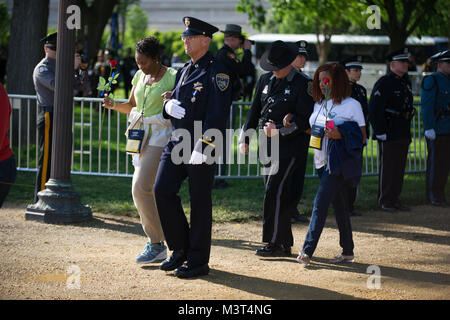 During This Year's Police Week Candlelight Vigil in Washington D.C. the U.S. Marshals Service honored two of our fallen deputies and hosted their families. In 2015 we lost both Josie Wells and Zacarias Toro. In 1962, President Kennedy proclaimed May 15 as National Peace Officers Memorial Day and the calendar week in which May 15 falls, as National Police Week. Established by a joint resolution of Congress in 1962, National Police Week pays special recognition to those law enforcement officers who have lost their lives in the line of duty for the safety and protection of others. Photo By: Shane Stock Photo