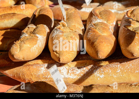 Traditional French baguettes at a market stall in Mirande, Gers (Gascony), Occitanie (Midi-Pyrénées), Southwest France Stock Photo