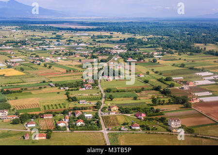 Aerial view from plane window on rural area of Zeta Plain around Podgorica Airport in Montenegro Stock Photo
