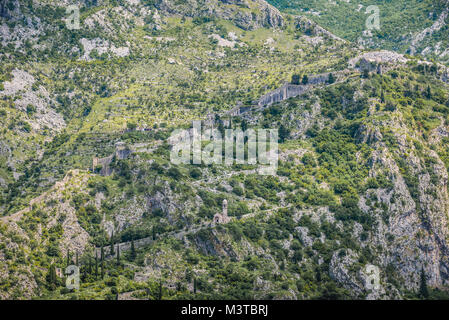 Church of Our Lady of Remedy and ancient fortress walls on the slope of Saint John mountain above Old Town of Kotor town in Bay of Kotor, Montenegro Stock Photo