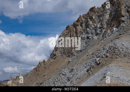 Sharp and dangerous rocks composed of sedimentary rocks Stock Photo