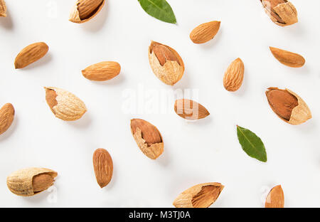 Almond nuts  on white background. Flat lay pattern Stock Photo