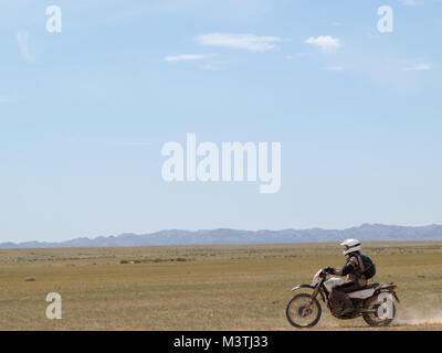 Motorcycling Gobi desert Stock Photo