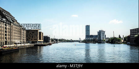 BERLIN-MAY 31:view of the Spree river with the Molecule Man sculpture in the distance and the Nhow Hotel on the left,Berlin,Germany,on May 31 2011. Stock Photo