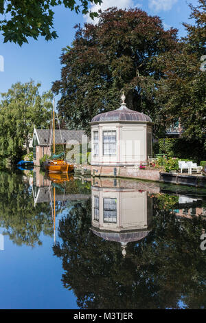Garden house and reflection in the water in Edam, Netherlands Stock Photo